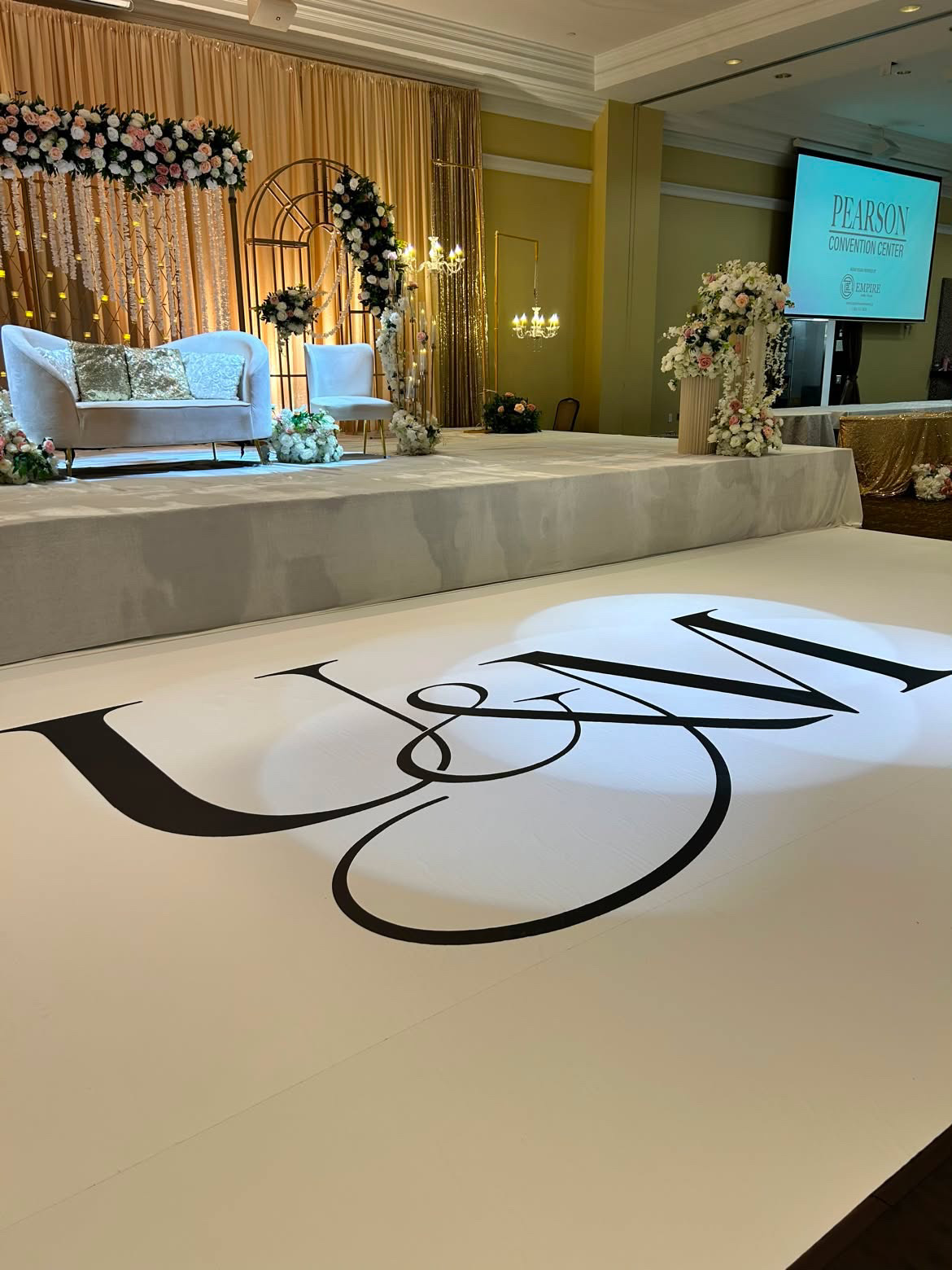 Event decorators collaborating with floor wrap installation